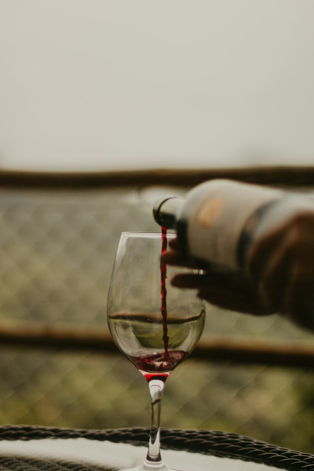 Red wine being poured into a glass