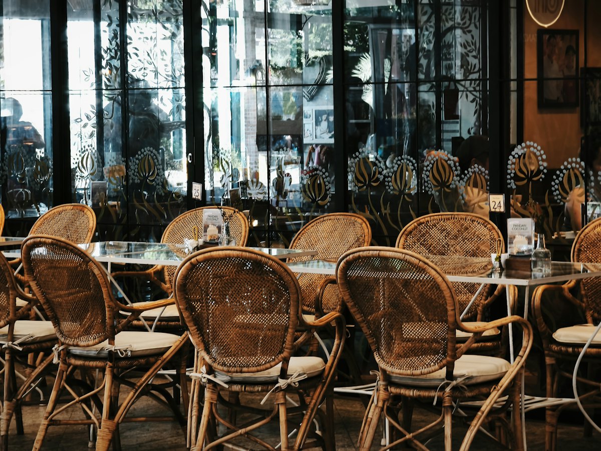 Wicker chairs in a dimly lit restaurant